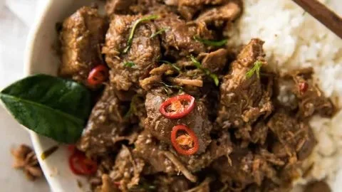 Delicious Beef Rendang with aromatic spices and tender beef served on a plate