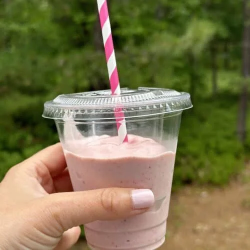 Delicious blended yogurt and fruit smoothie in a glass