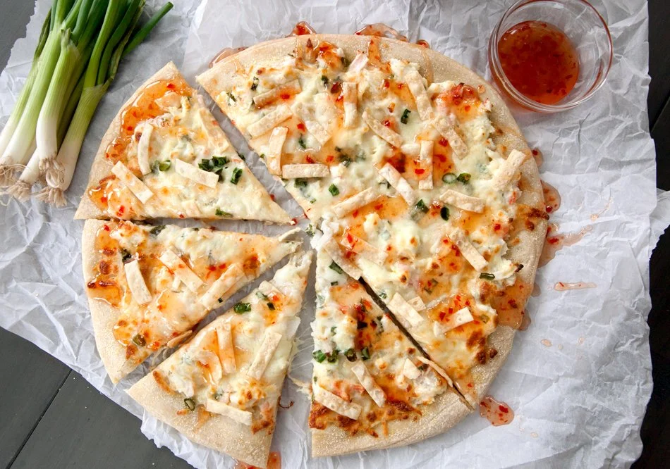 Delicious Crab Rangoon Pizza fusion topped with cream cheese and crab