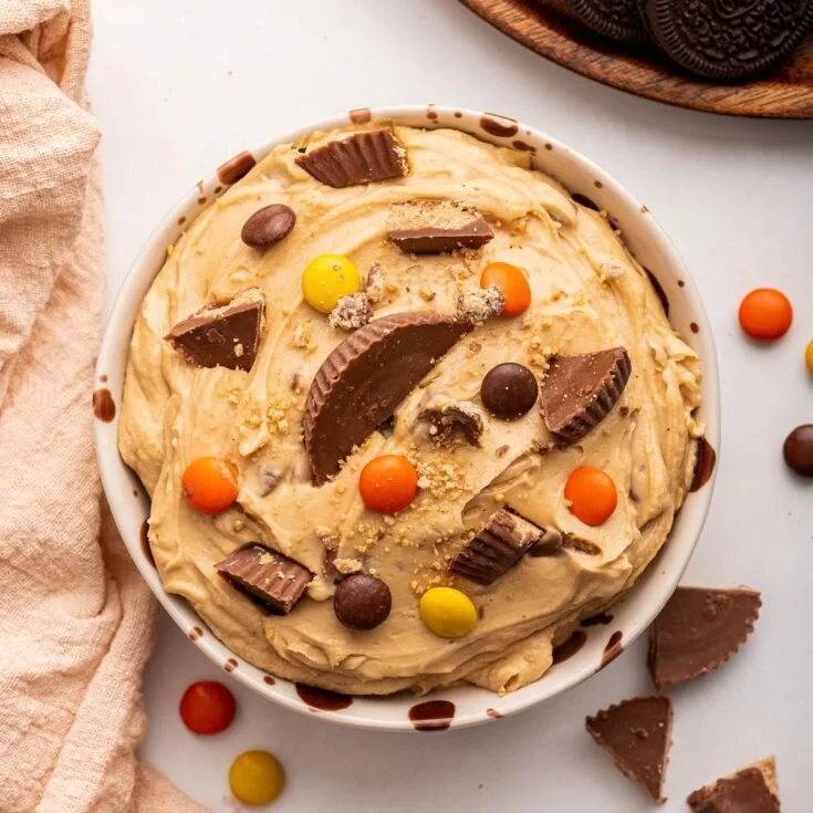 Creamy peanut butter dip served in a bowl with dippers.