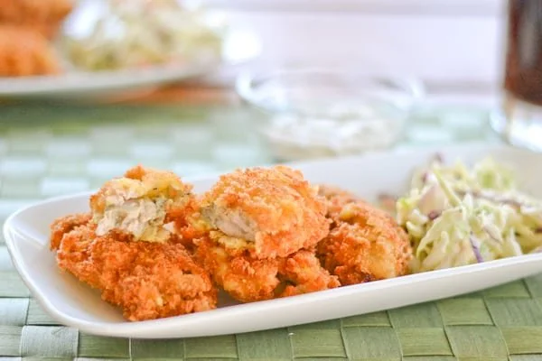 Plate of crispy deep fried oysters served with dipping sauce