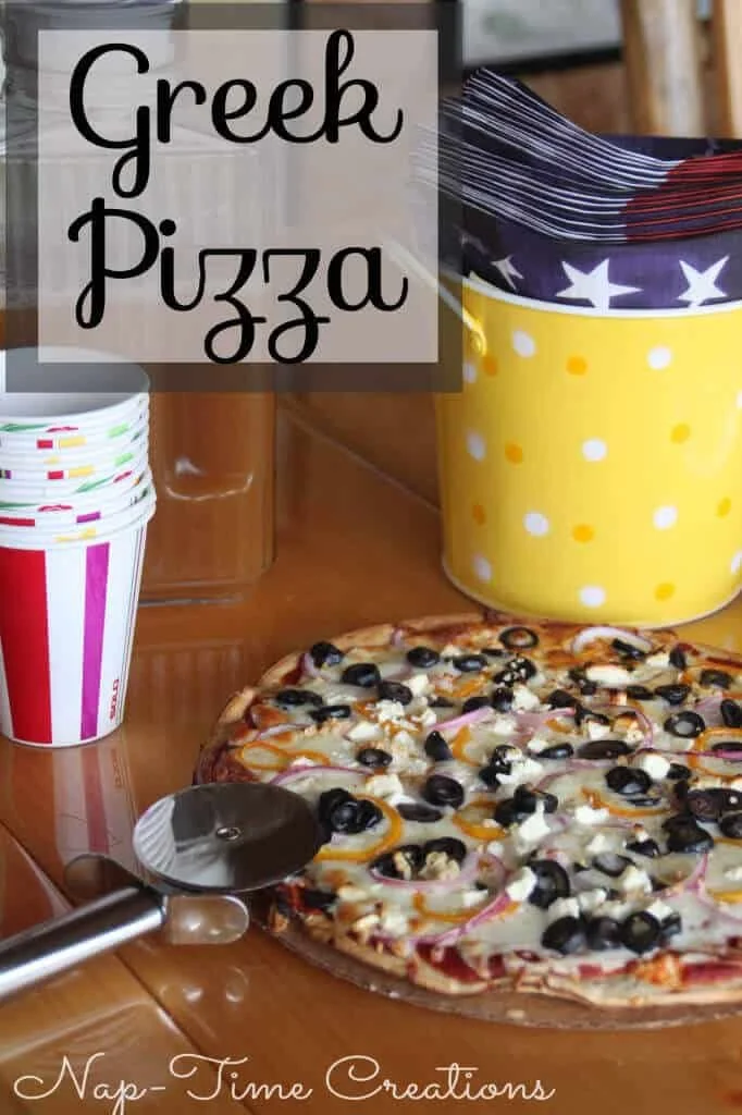 Delicious Greek pizza topped with fresh vegetables and feta cheese