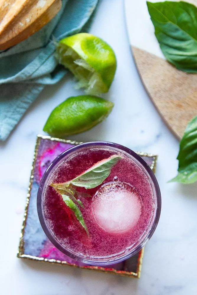 A refreshing glass of Jamaican Spanish beverage served with tropical fruits.