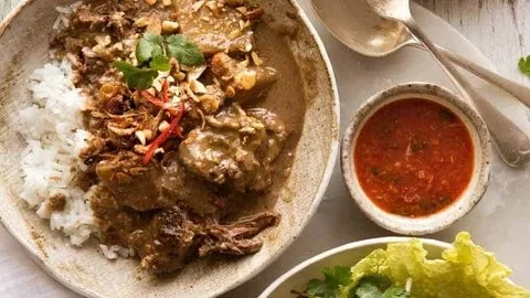 Delicious Massaman Curry served in a traditional bowl, showcasing rich ingredients.