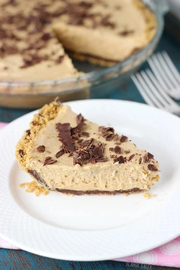 Slice of no-bake chocolate peanut butter pie on a plate