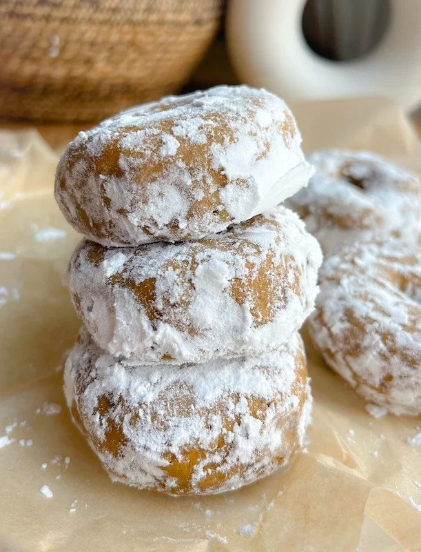 No-bake vegan pumpkin spice protein donuts on a wooden table
