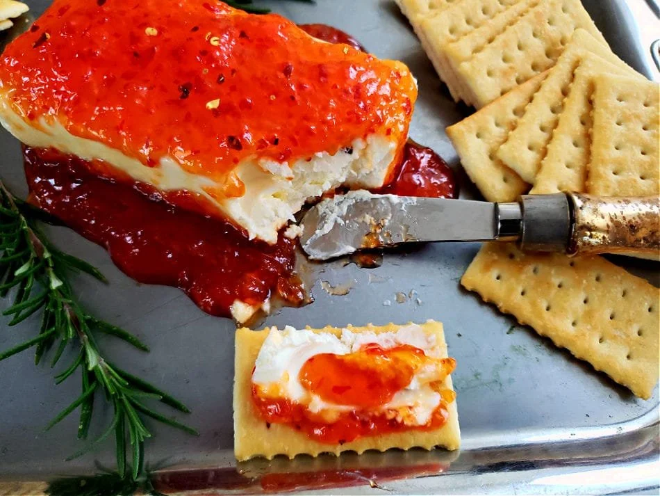Delicious pepper jelly cream cheese bites served as appetizers.