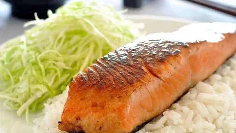 Grilled salmon fillet glazed with mirin and soy sauce served on a plate