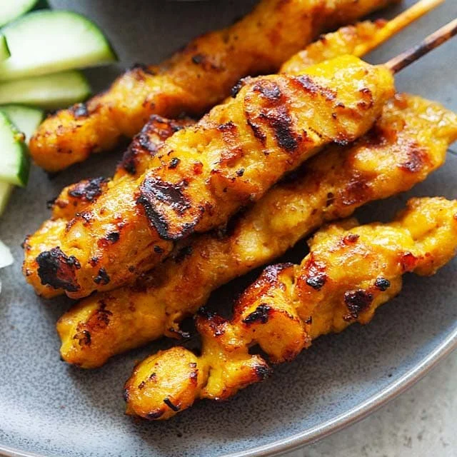 Delicious homemade chicken satay skewers served with peanut sauce