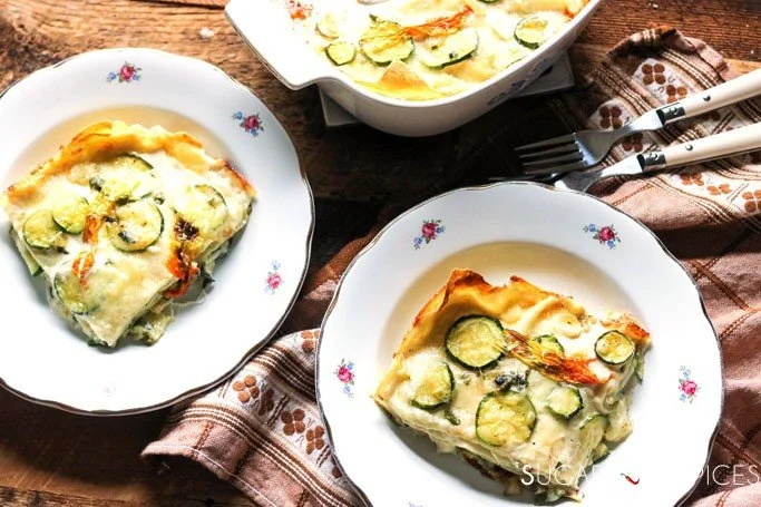 Delicious white lasagna with zucchini blossoms and creamy sauce